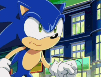 sonic the hedgehog is standing in front of a building with a fist in the air