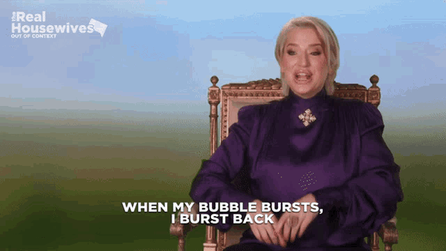 a woman sitting in a chair with the words " when my bubble bursts i burst back " on the screen