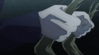 a person in white gloves is holding a stick in their hand .
