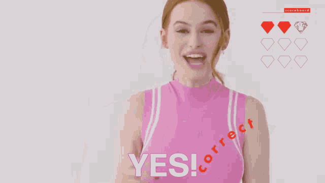 a woman in a pink tank top says yes and correct