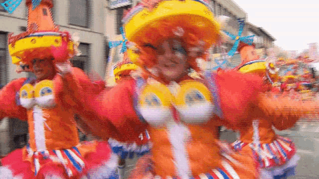 a blurred image of a parade with a sign that says ' snoopy ' on it