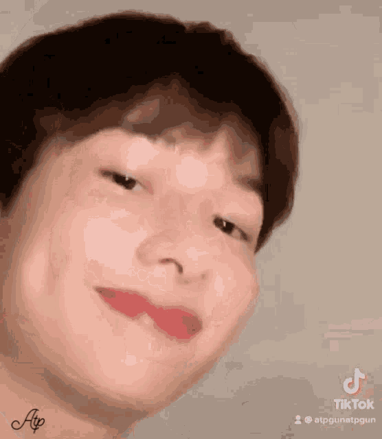 a close up of a person 's face with a tik tok watermark