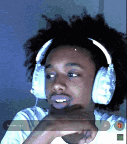 a man wearing headphones with the word send message at the bottom of the screen