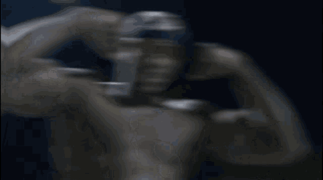 a man without a shirt is flexing his muscles and wearing sunglasses