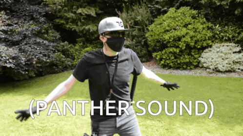 a man wearing a mask and a helmet with the word panther sound written on the bottom