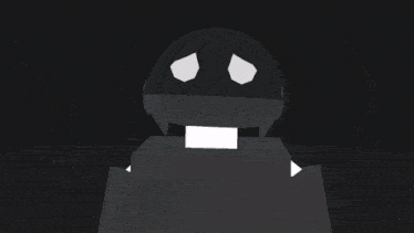 a black object with a white square in the middle of it 's mouth