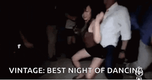 a man and a woman are dancing at a party .