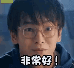 a young man wearing glasses and a blue jacket is making a face .