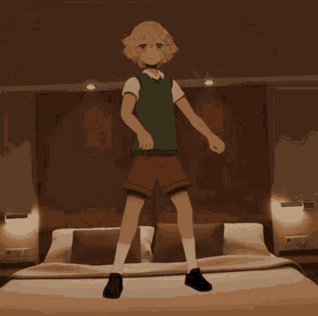 a boy in shorts and a green vest is standing on a bed