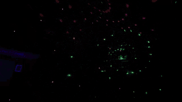 a dark room with a lot of colorful lights