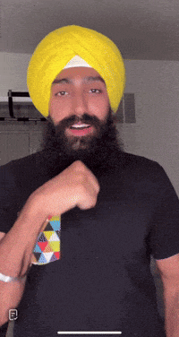 a man with a beard and a yellow turban on his head