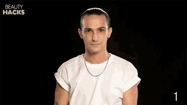 a man is holding cotton pad and eyelash glue in his hands