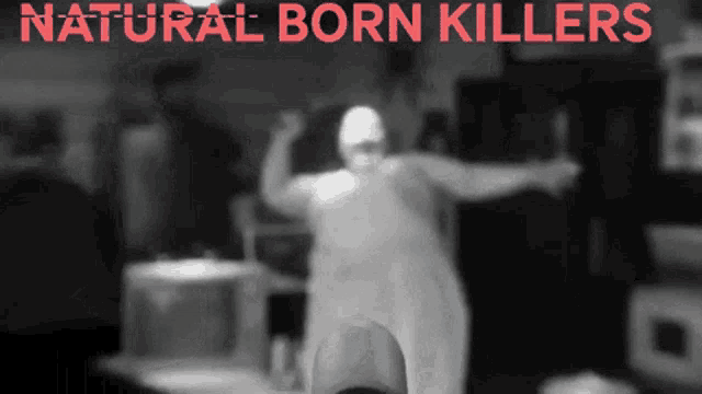 a blurred image of a person with the words natural born killers on top