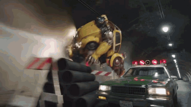 a yellow car is being turned into a robot and flying over a green car