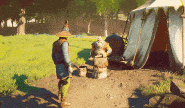 a man in a wizard hat stands in front of a tent while a man hammers a piece of metal