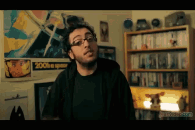 a man is standing in front of a poster that says 2001 is a spacer