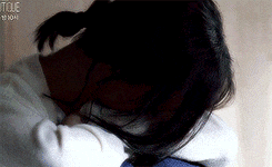 a close up of a person 's face with the word tcl on the bottom left