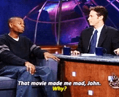 two men are sitting at a table with the words that movie made me mad john why