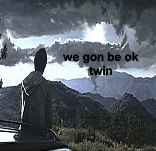 a man standing in front of a mountain with the words we gon be ok twin written above him