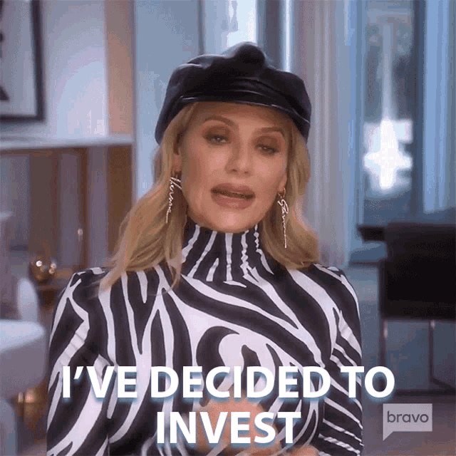 a woman in a zebra print top says i 've decided to invest on bravo