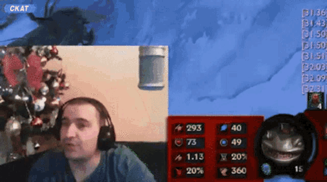 a man wearing headphones is sitting in front of a screen that says ' ck at ' on it