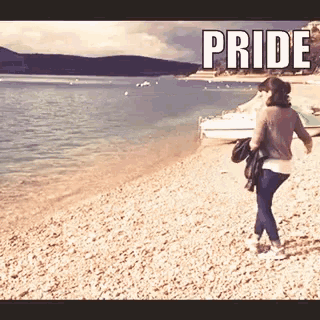 a picture of a woman walking on a beach with the words pride above her