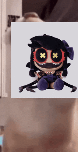 a picture of a stuffed doll with x 's on her eyes