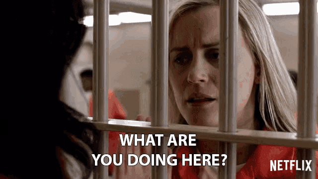 a woman in a jail cell with the words what are you doing here on the bottom