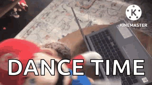 a video that says dance time is being played on a laptop computer