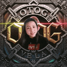 a woman is smiling in front of a logo that says vela
