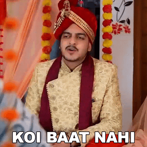 a man wearing a turban and a suit says koi baat nahi .