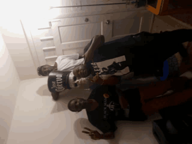 a man wearing a black t-shirt that says black man