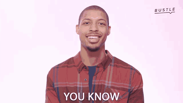 a man wearing a plaid shirt says you know