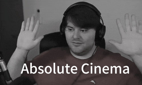 a man wearing headphones with the words absolute cinema on the bottom right
