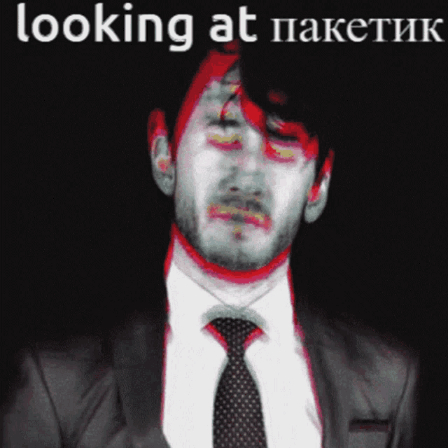 a man in a suit and tie with the words looking at on the bottom
