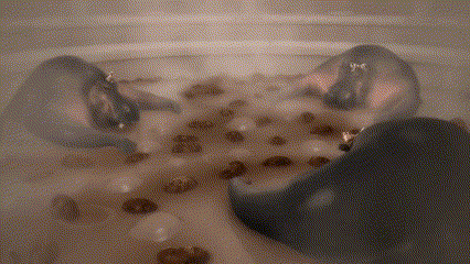 a person is laying in a bathtub filled with water