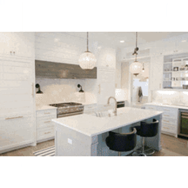 a kitchen with a large island in the middle
