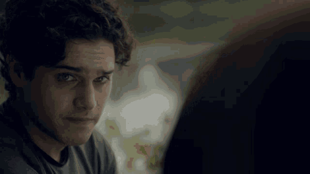 a close up of a man 's face with a serious look on his face