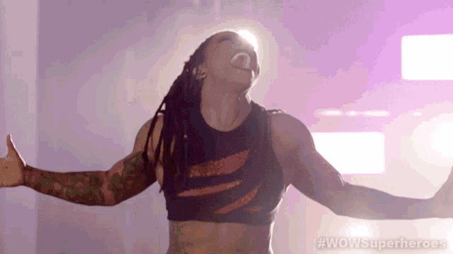 a woman with her arms outstretched and the words wowsuperheroes written on the bottom