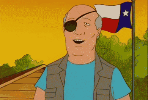 a bald man wearing a pirate eye patch stands in front of a flag of texas