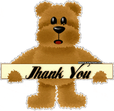 a teddy bear holding a thank you sign