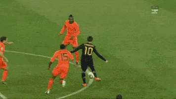 a soccer game is being played in front of an adidas sign