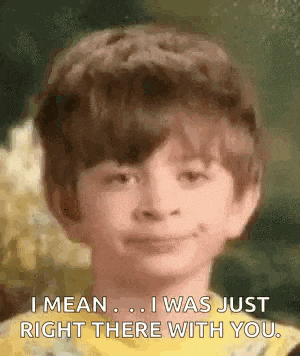a young boy in a yellow shirt is smiling and saying `` i mean ... i was just right there with you . ''