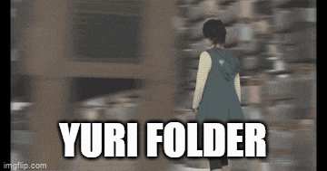 a girl in a green dress is walking in front of a wall with the words yuri folder above her .