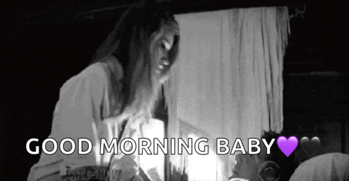 a black and white photo of a woman kissing a man in bed with the words `` good morning baby '' .