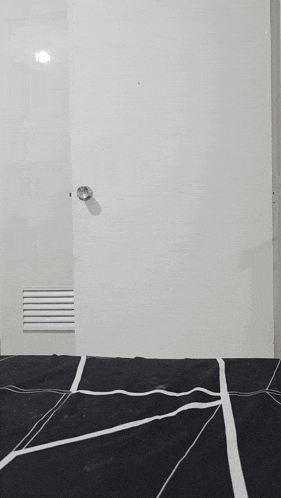 a dog laying on a bed with the words " penge ako treats " written on the wall behind it