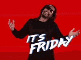 a man in a black shirt with the words it 's friday on it