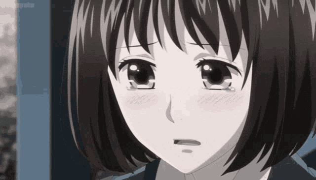 a close up of a girl 's face with tears coming out of her eyes .