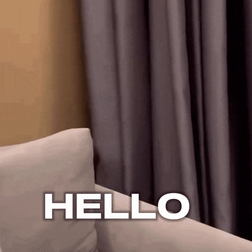 a couch with a pillow and the word hello on it
