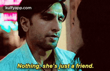 a man is talking to a woman and saying `` nothing , she 's just a friend '' .